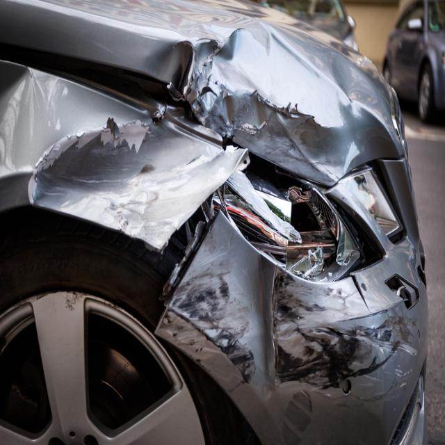 Severe multi-panel front-end collision under inspection